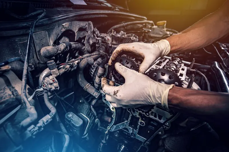 Technician working on an engine