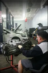 Technician rebuilding an engine